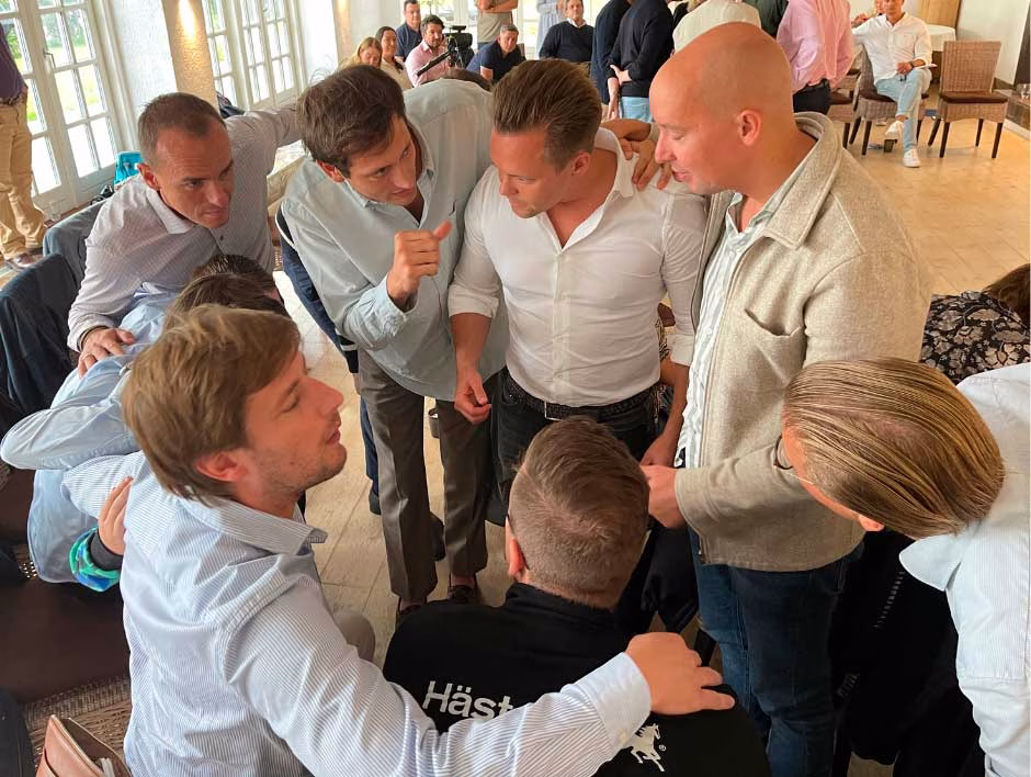 Participants working in small groups during NLP Consultant Certification training